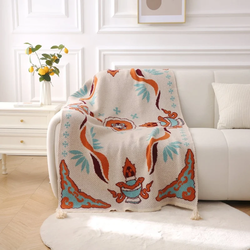 Plaid beige à motifs bleus et orange 130 x 180 cm SVELTA